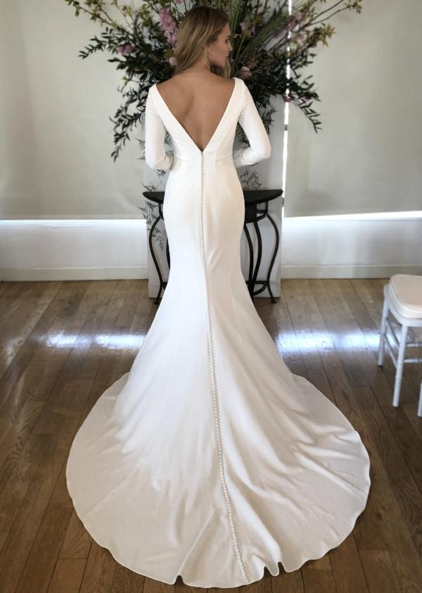 Wedding dress with long sleeves and plunging back